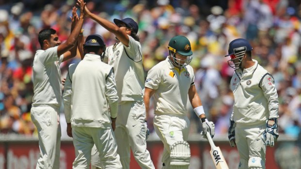 Ravichandran Ashwin of India celebrates with his teammates after dismissing Shane Watson 