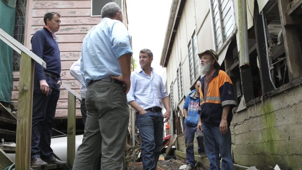 Premier Mike Baird inspects flood damage in Dungog.