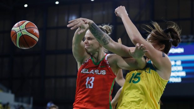 Belarus forward Tayana Troina (13) and Australia forward Cayla George battle for the rebound.