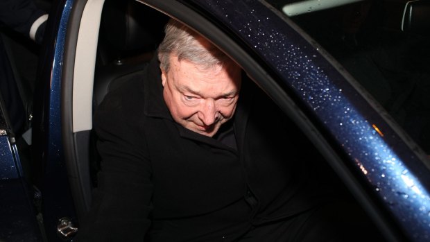 Cardinal Pell arrives at the hearing in Rome.