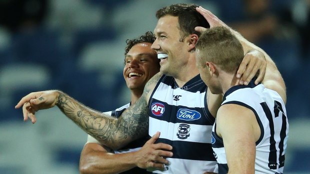 On form: Mitch Clark of the Cats (centre) celebrates a goal with teammates.