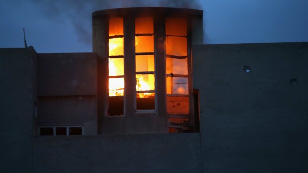 A house burns in Sinjar, northern Iraq.