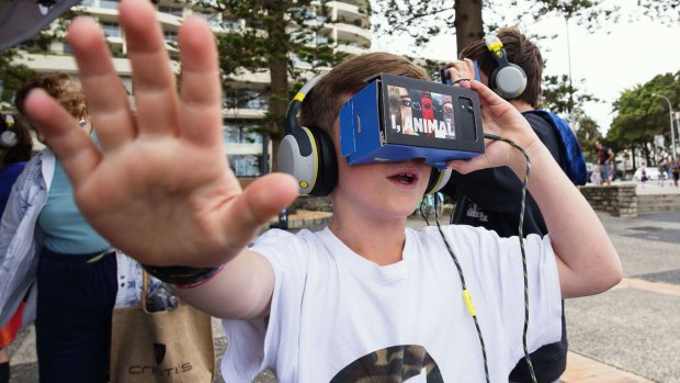  Nick and Ben Layton using iChicken virtual reality gear at Manly Wharf.