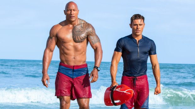 "Dwayne is a machine," says Zac Efron, who stuck to a dramatic diet and training schedule for four months for the movie.