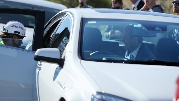 Bill Shorten comforts one of the drivers and her son in the back of his official car. 