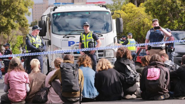 Squatters from East West Link housing in Bendigo Street, Collingwood defy police last month. 