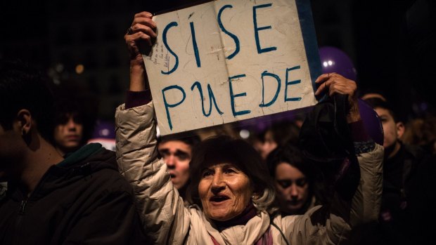 A Podemos (We Can) supporter holds up a banner reading 'Yes, we can' after elections in December. But a coalition government could not be formed and Spaniards will need to return to the polls.