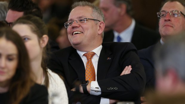 Treasurer Scott Morrison listens to Mr Turnbull at the National Press Club.