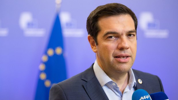 'We fought hard abroad, we must now fight at home against vested interests' ... Greek Prime Minister Alexis Tsipras speaks to journalists following bailout talks in Brussels, Belgium.