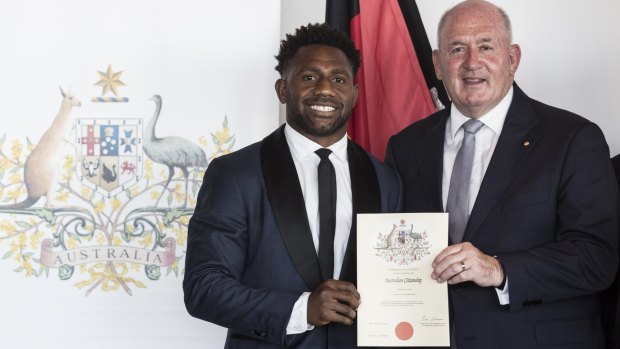 New Aussie: James Segeyaro with Governor General Peter Cosgrove at the Australia Day ceremony on Tuesday.