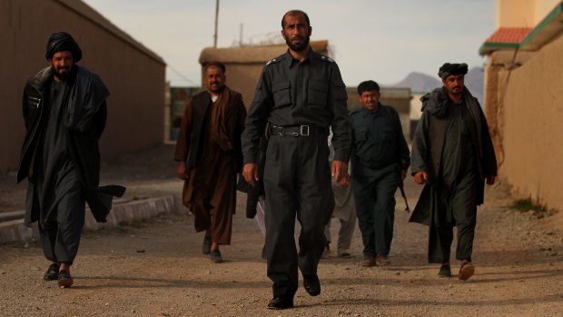 Matiullah Khan and his men at his compound in Tarin Kowt in January 2013.