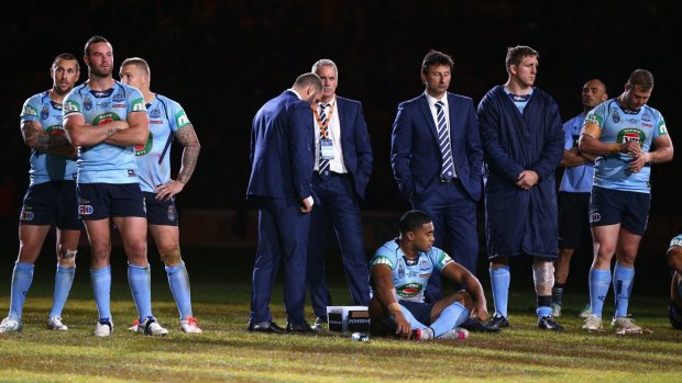 Hard to swallow: Blues coach Laurie Daley and his team after losing game three.
