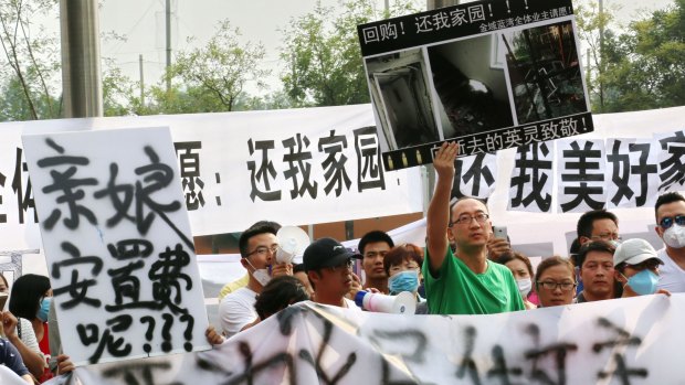 The state is struggling to contain public anger over the sharemarket collapse and the recent explosions at Tianjin, where these protesters took to the streets.