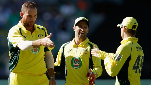 Handy work:  John Hastings congratulates Steve Smith after the dismissal of India's Ajinkya Rahane.