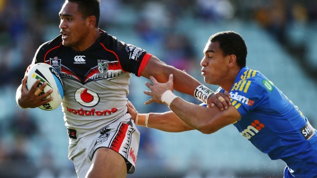 At arm's length: Solomone Kata puts a fend on Will Hopoate.