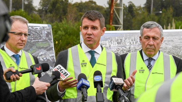 NSW Premier Mike Baird, centre, Roads Minister Duncan Gay, right, and Federal Minister for Urban Infrastructure Paul Fletcher at the Rozelle Rail Yards. 