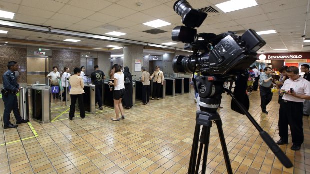 Members of the media await news of Lee Kuan Yew's health at the Singapore General Hospital on Wednesday. 