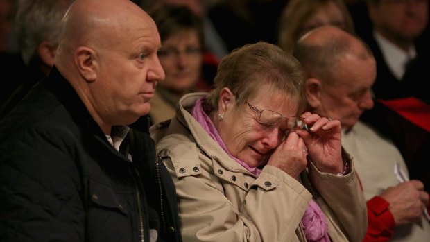 People attend a memorial service and vigil at Birmingham Cathedral to mark 40 years since the Birmingham pub bombings on November 21, 2014.