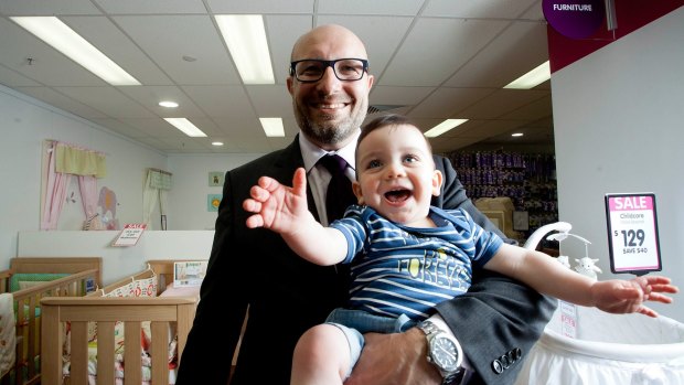 Baby Bunting chief executive Matt Spencer with baby Oscar Parnall.