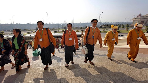 Myanmar lawmakers arrive to attend the final session of Myanmar's parliament as it ends its five-year term on Friday, January 29.