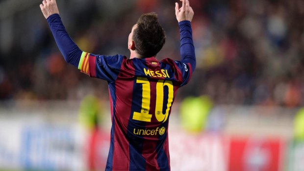 Messi magic: Barcelona's Lionel Messi points to the sky after scoring against APOEL Nicosia.
