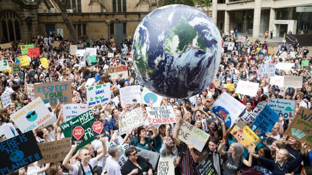 Students go on strike from school to protest at a climate change rally.