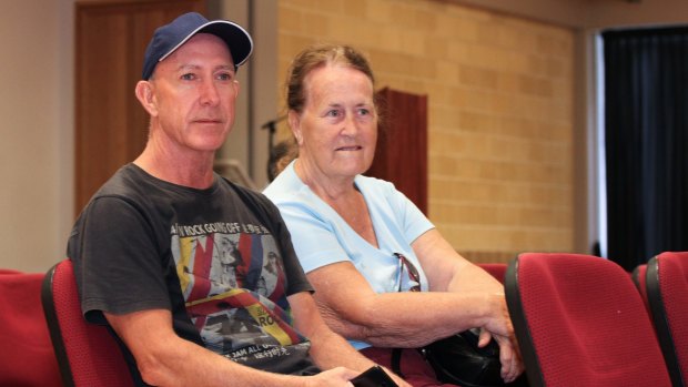 Pauline Schroll and her son, Steven Berr, wait at the Beenleigh evacuation centre after flooding in Logan.