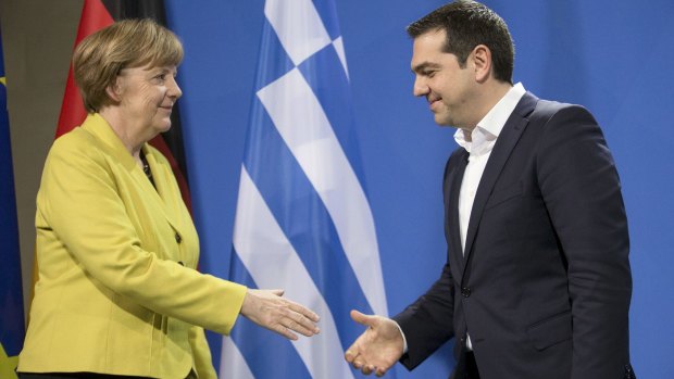 Forced smiles: German Chancellor Angela Merkel and Greek Prime Minister Alexis Tsipras are still far from seeing eye-to-eye.