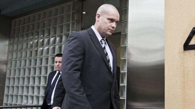 Stray bullet: Senior Constable David Roberts leaves the Coroners Court.