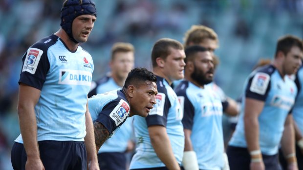 Not again: The Waratahs look dejected after another Crusaders try.