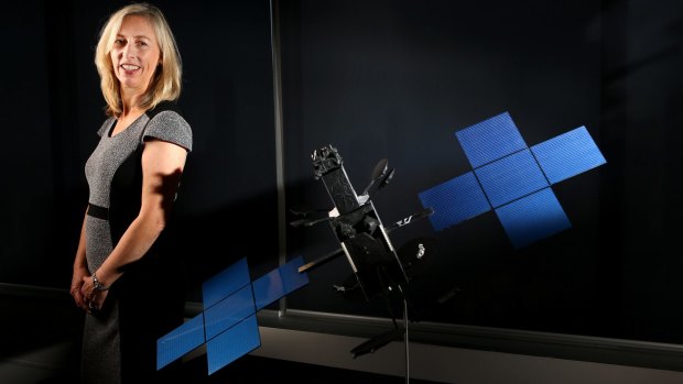 Satellite architect Julia Dickinson with a model of an NBN Co broadband satellite.