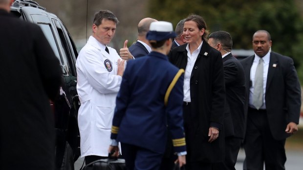 Ronny Jackson, physician for Trump, gives a thumbs following the president's first medical exam.