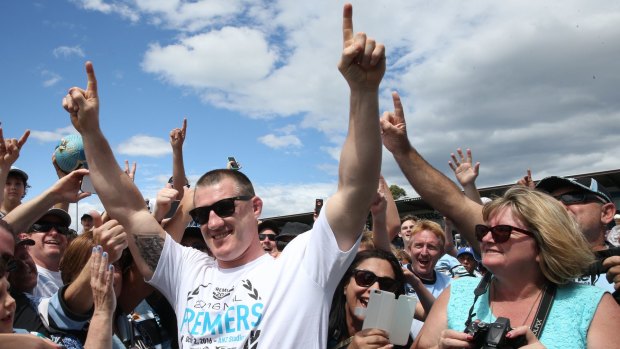 Sharks skipper Paul Gallen celebrates with fans at Shark Park on Monday.