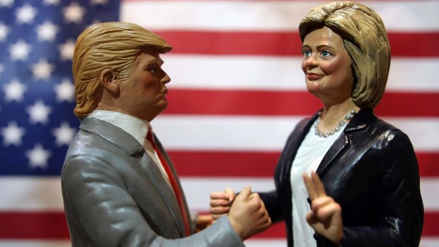 Statuettes depicting the presidential candidates Donald Trump, left, and Hillary Clinton in a shop in Via San Gregorio Armeno, the street of nativity scene craftsmen, in Naples, Italy.