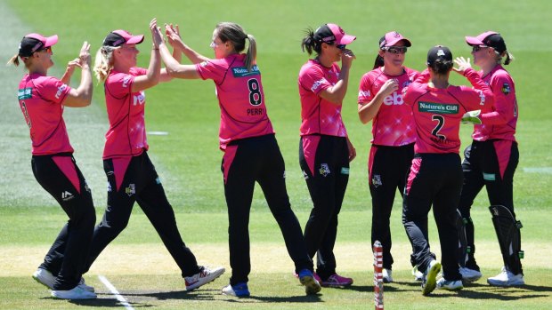 On the way: Sixers players celebrate the dismissal of Natalie Sciver.