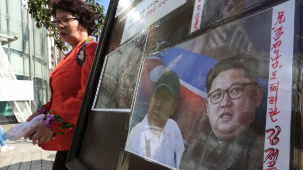 A sign shows images of Kim Jong-un, right, and his older brother Kim Jong-nam during a campaign to improve human rights condition in North Korea, in Seoul, South Korea last week.