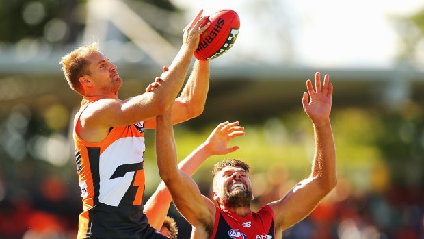 Joel Patfull of the Giants competes with Mark Jamar of the Demons during the round two AFL match between the Greater Western Sydney Giants and the Melbourne Demons at Startrack Oval.