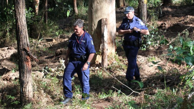 Police search an area of the Royal National Park for the body of Matthew Leveson.