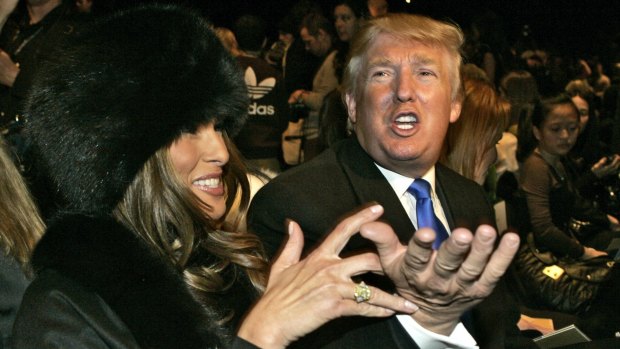 Donald Trump and his wife, Melania, whom he sat next to his alleged mistress at his Mar-a-Lago Club.