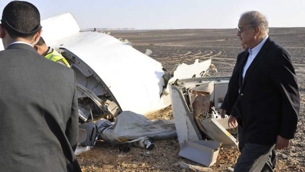 Egypt's Prime Minister Sherif Ismail, inspects the remains of the crashed passenger jet.