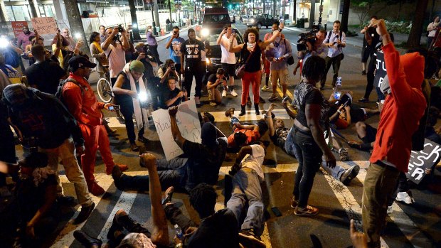 Protesters block an intersection in Charlotte.