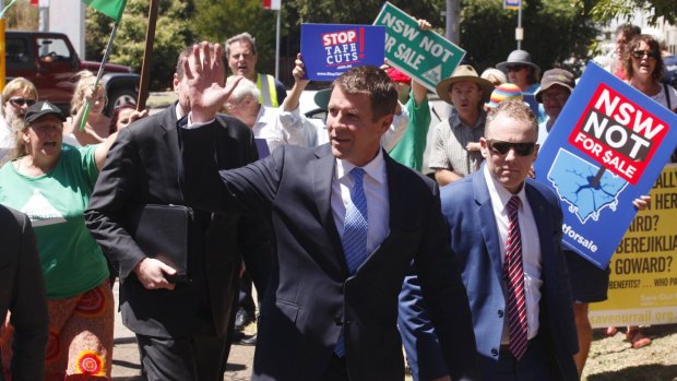 NSW Premier Mike Baird is met by protesters at Hunter TAFE.