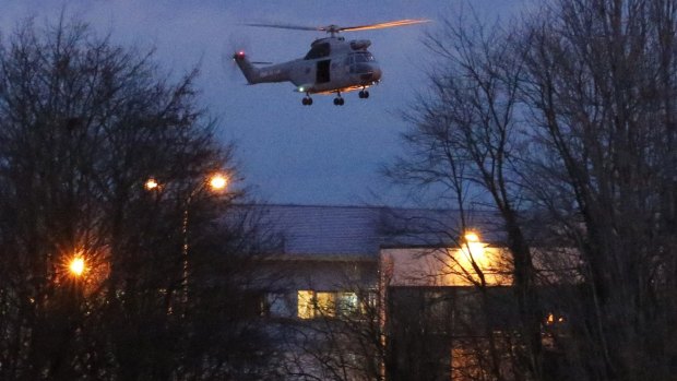 A helicopter hovers after the final assault at the scene of a hostage taking at an industrial zone in Dammartin-en-Goele, north-east of Paris.