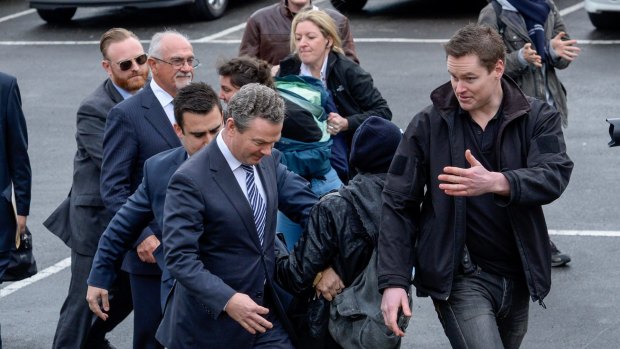 Student protesters confront Education Minister Christopher Pyne at Victoria University's Nicholson Campus in Footscray. 