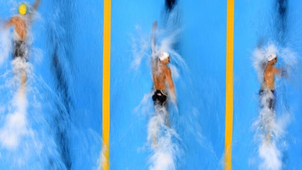 From left: Kyle Chalmers, American Caeleb Dressel and France's Jeremy Stravius of France compete in the men's 100m freestyle heat.
