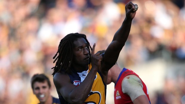 For you: Nic Naitanui gestures skywards in acknowledgment of his mother, Atetha.