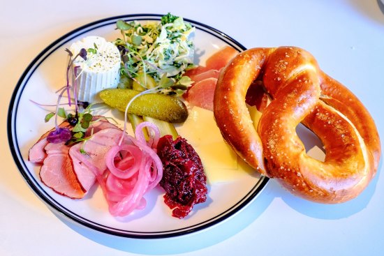 Austro's pretzel plate with cured meats, cheese and pickles.