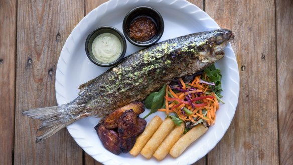 Spice-marinated and charcoal-grilled whole boning fish.