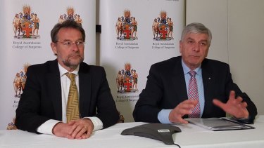 Royal Australasian College of Surgeons president David Watters (lelft) and Rob Knowles, chairman of the college's expert advisory group on bullying. 