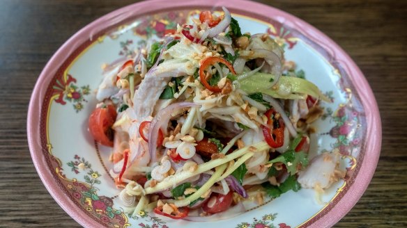 Summer on a plate: Shredded coconut-poached chicken with green mango and prawns.